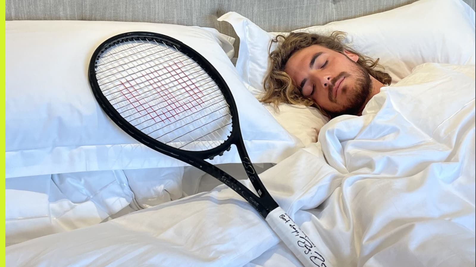 Stefanos Tsitsipas with Roger Federer's racket